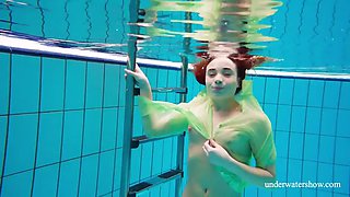 Hairy teen babe Nina Mokhnatka swims in the pool