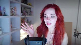 Redheaded pierced teen close up toy show
