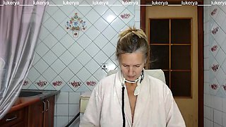 Hot mistress Lukerya in the kitchen in a bathrobe