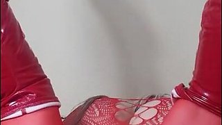 Susi teasing with toy in red fishnet