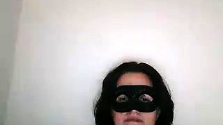 Masked brunette milf has fun with sex toys on the webcam