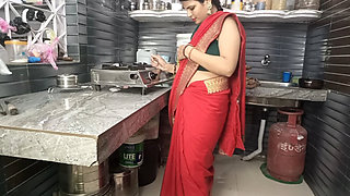 In the kitchen, the brother-in-law made the beautiful sister-in-law in red saree do the doggy style and fucked her.