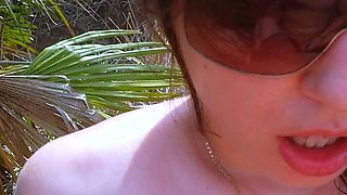 A super sexy brunette massages her big boobs