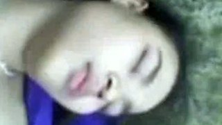 Malaysian babe outdoors with political party flags.