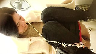 Cute amateur asian web cam girl playing with her toy