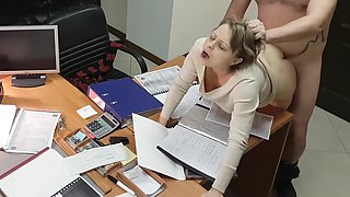 Hot office secretary sucks and rides her boss on the desk