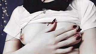 Gothic girl dressed as a Japanese schoolgirl with small tits and beautiful nipples