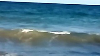 My stepdaughter teases me on the beach