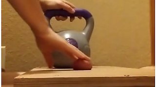 Wife Crushes Balls With Kettle Bells