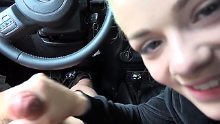 Beautiful blonde teen gives a wonderful handjob in the car