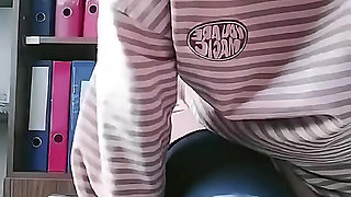 Turkish girl with headscarf who turns on the camera and puts on a show at the construction site