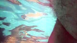 Nasty perve strokes his dick in the public pool jacking off on the girls