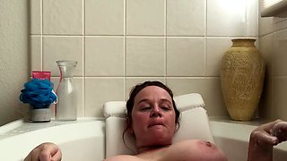 Attractive brunette teenager with big boobs fingering pussy