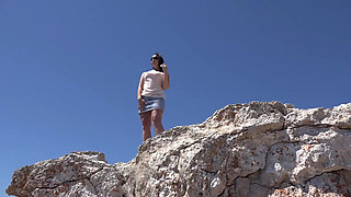 Brunette babe with nice tits is pissing by the pool