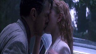 Drew Barrymore making out with a guy on the hood of a car
