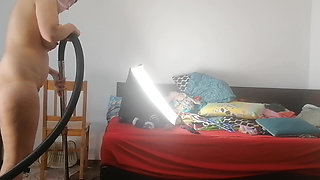 Amateur wife vacuuming in the bedroom. Sexy naked wife preparing food in the kitchen.