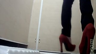 White chick in red shoes and skinny jeans pissing in the toilet