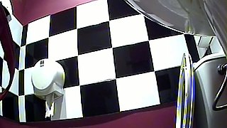 Long haired brunette girl in the toilet pissing on hidden cam