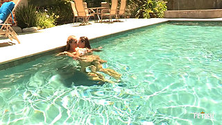 Two gorgeous young lesbians gets naughty in the pool