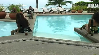 2 sexy Latina's presenting latex fetish in the pool and on the beach