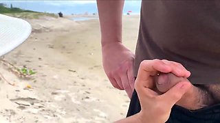 A cougar jack off a stranger on a public beach for a bet!