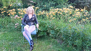 A Mature Woman Is Wearing Sheer Tights Outside.