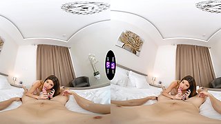 Two sexy babes ride a big dick in a steamy virtual reality scene