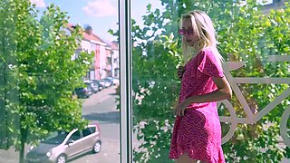 Outdoor solo masturbation scene with curly blonde