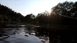 Tattooed Babe Strips and Swims on a SUP Board in the Forest