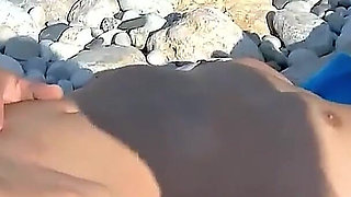 Milf Debora is approached by a stranger and fucked on the beach and her boyfriend is next to her