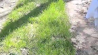 Beautiful Woman Undressing and Walking Nude with a Clit Pump Outdoors in a Public Forest