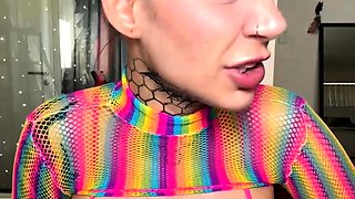 Inked Hottie with Buns Teases in Shiny Rainbow Mesh Top