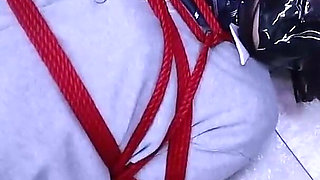 The Lovely Girlfriend Is Bound by Gloves, a Collar, and a Gag