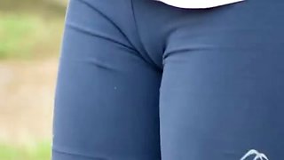 Two sporty girls flash their cameltoe in the street